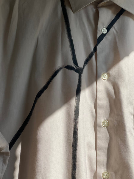 DETAILS OF HAND PAINTED BLACK SKINNY TIE ON FRONT SECONDHAND BUTTON DOWN SHIRT.