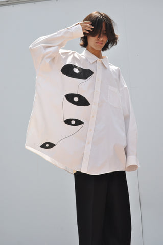 FRONT VIEW OF HAND PAINTED OVERSIZED BUTTON DOWN SHIRT IN WHITE.