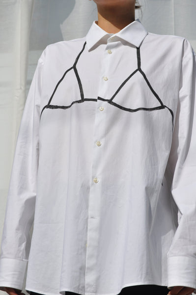 DETAILS OF HAND PAINTED BIKINI TOP IN BLACK ON WHITE OVERSIZED SECONDHAND BUTTON DOWN SHIRT.