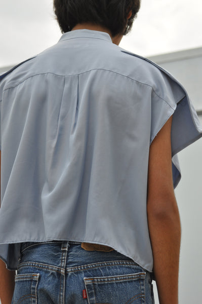 BACK IMAGE OF CROPPED BUTTON DOWN SHIRT.