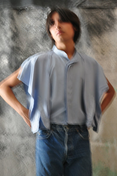 BLURRED IMAGE OF RECONSTRUCTED BUTTON DOWN SHIRT.