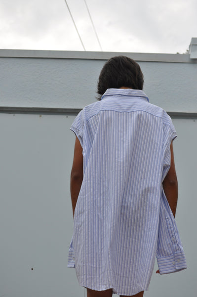 BACK VIEW OF STRIPE BUTTON DOWN SHIRT.