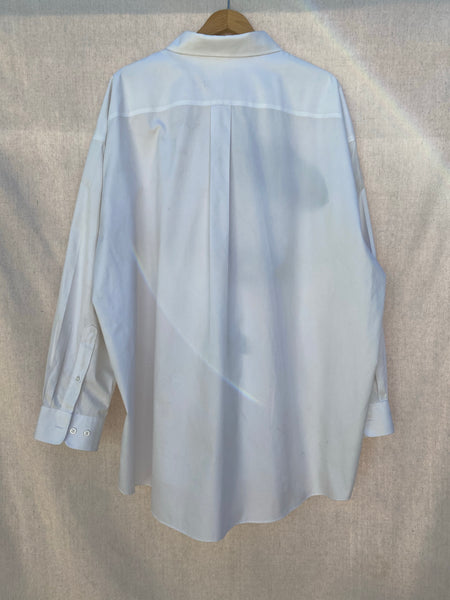BACK IMAGE OF WHITE OVERSIZED BUTTON DOWN SHIRT.
