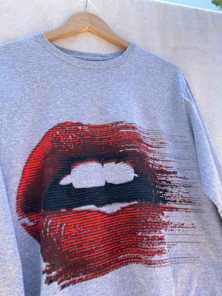 CLOSE UP OF PRINTED MOUTH WITH RED LIPS.