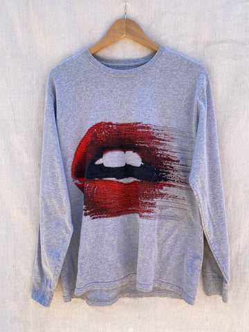 FULL FRONT VIEW OF LONG SLEEVE TEE WITH PRINTED MOUTH WITH RED LIPS.