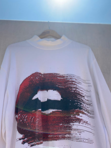 CLOSE UP VIEW OF PRINTED MOUTH WITH RED LIPS.