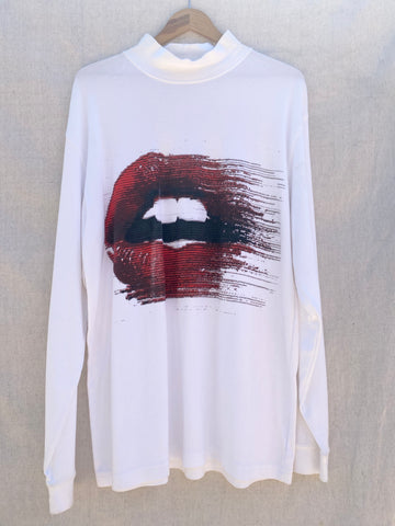 FONT VIEW OF WHITE LONG SLEEVES TEE WITH MOCK NECK. PRINTED WITH MOUTH WITH RED LIPS.