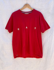 FRONT VIEW T-SHIRT IN RED WITH R A D EMBROIDERY AT CENTER FRONT CHEST.