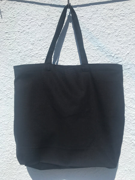BACK VIEW OF TOTE BAG IN BLACK. BACK SIDE HAS NO PRINT.JUST PLAIN BLACK.
